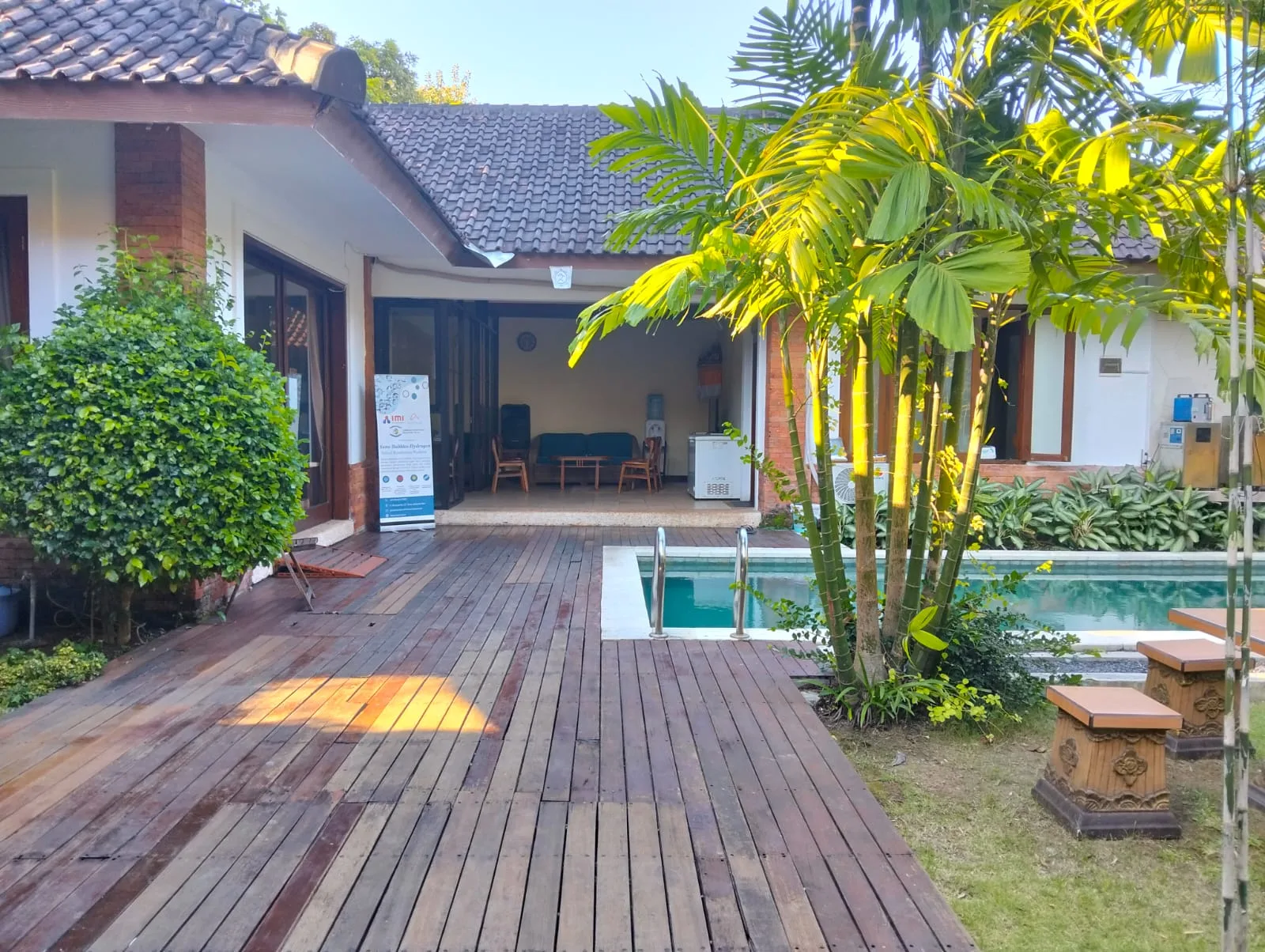 A traditional Balinese pavilion surrounded by garden
